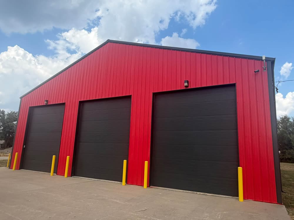 The Training Center, a red metal building with three apparatus bay doors